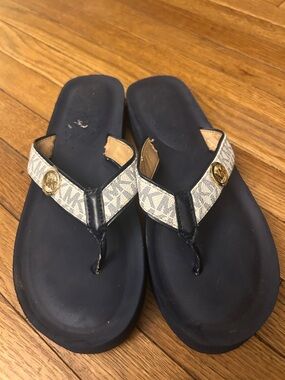 Woman’s 11 Michael Kors Navy and Beige Logo Thong Sandals